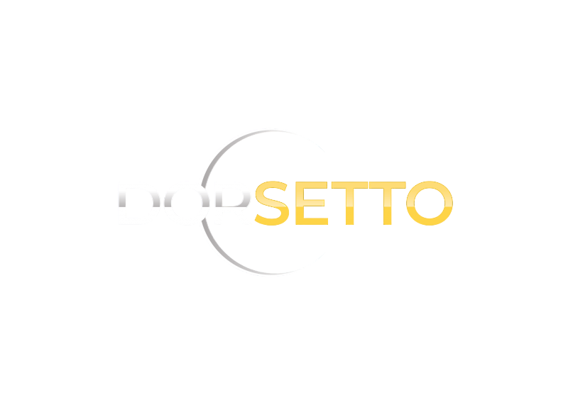 Billedet viser ordet DORSETTO med store bogstaver. DOR er lysegrå, SETTO er gul, og der er en delvis grå cirkel i baggrunden på en hvid flade.